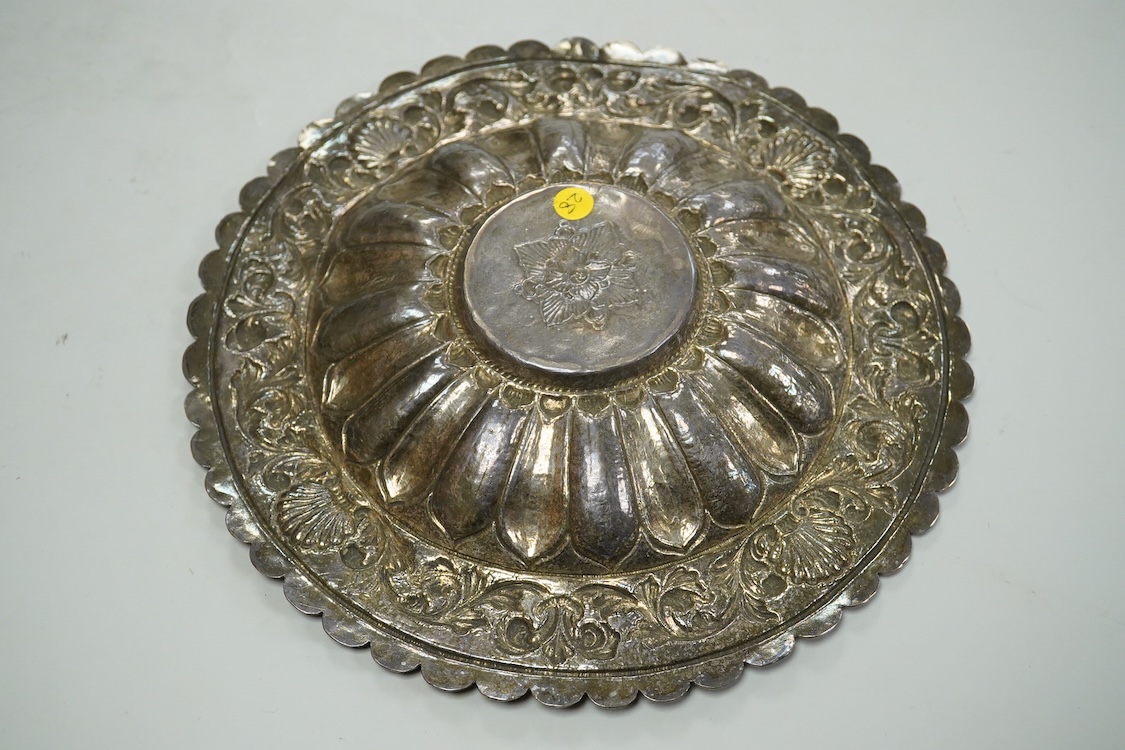 A 19th Century Indian white metal repousse dish, with cusped border, diameter 26.1cm, 14.1oz.